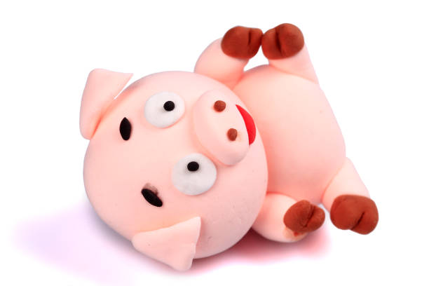 istock Paper clay pig on a white background 1207445030