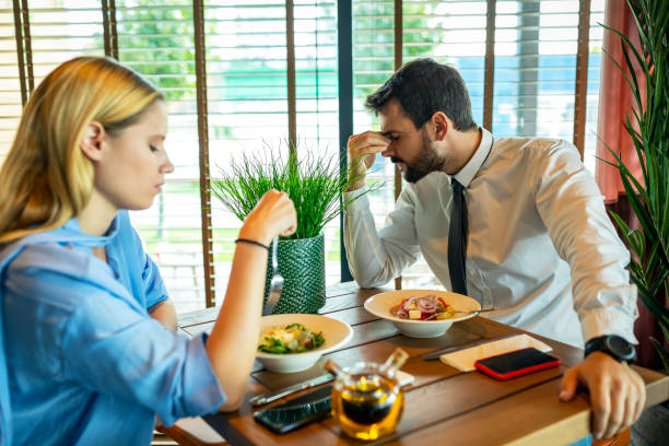 Modern Young Couple is Having a Relationship Problems During a Tasty Lunch in Restaurant.