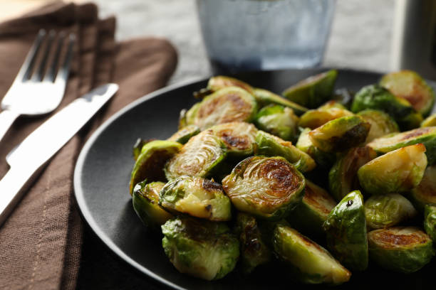 istock Composition with fried brussels sprout on grey background, close up 1207449392
