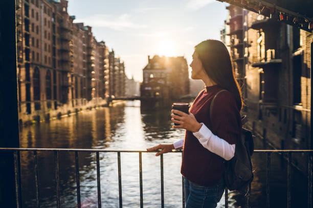 istock Woman exploring Hamburg old town 1207450442