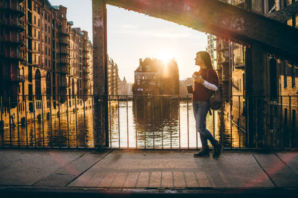 istock Woman exploring Hamburg old town 1207450488