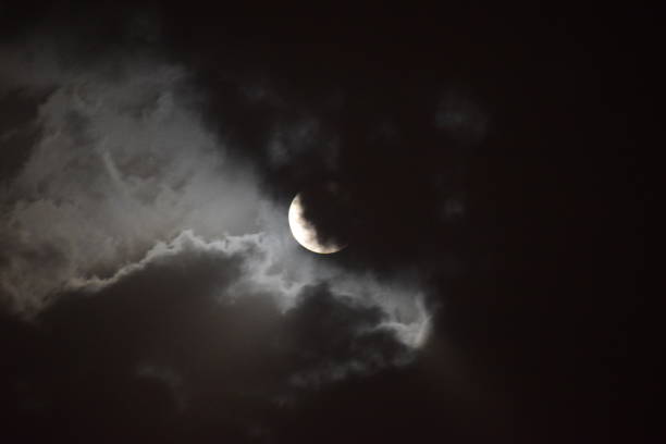 istock Full moon view during cloudy night in the sky 1207452304