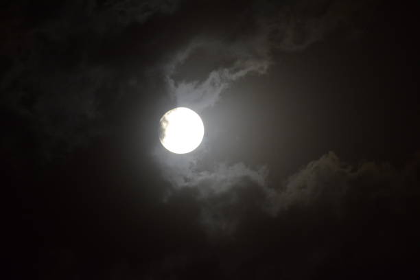 istock Full moon view during cloudy night in the sky 1207452885