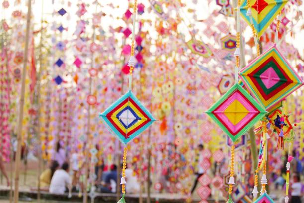 istock Selective focus  colorful  mobile is made of  cotton on blurred  light background , colorful  landscape view  under day light  use for background or wallpaper . 1207453138