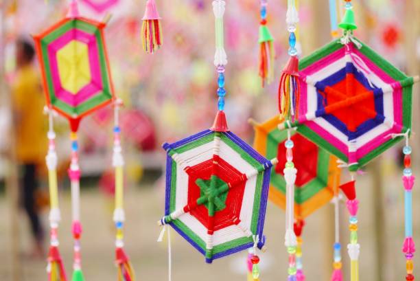 istock Selective focus  colorful  mobile is made of  cotton on blurred  light background , colorful  landscape view  under day light  use for background or wallpaper . 1207453166