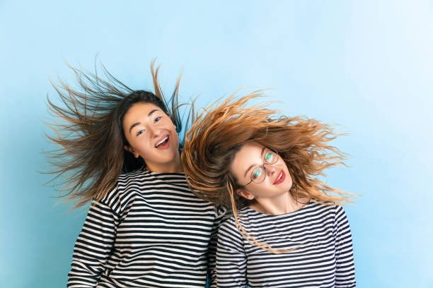 istock Young emotional women on gradient blue background 1207453878