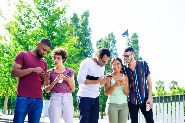 istock Happy people in casual using smartphones 1207454818