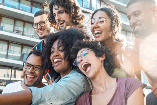 istock Funny mix raced friends taking group selfie 1207455949