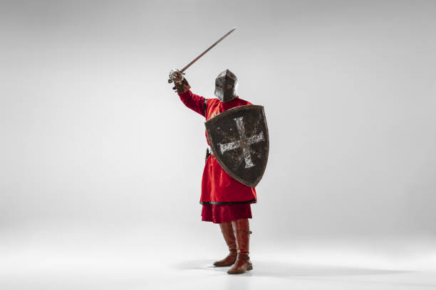 istock Brave armored knight fighting isolated on white studio background 1207456847