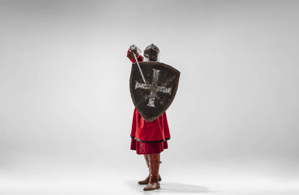 istock Brave armored knight fighting isolated on white studio background 1207456877