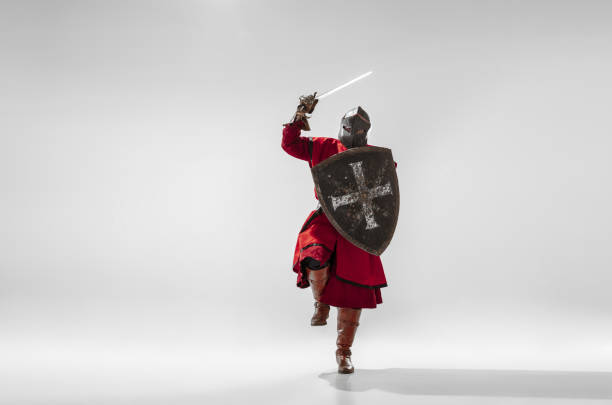 istock Brave armored knight fighting isolated on white studio background 1207456883