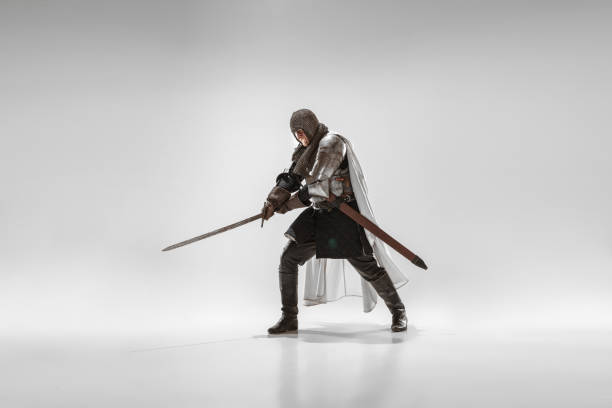 istock Brave armored knight fighting isolated on white studio background 1207456895