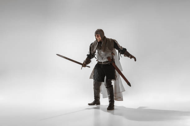 istock Brave armored knight fighting isolated on white studio background 1207456896
