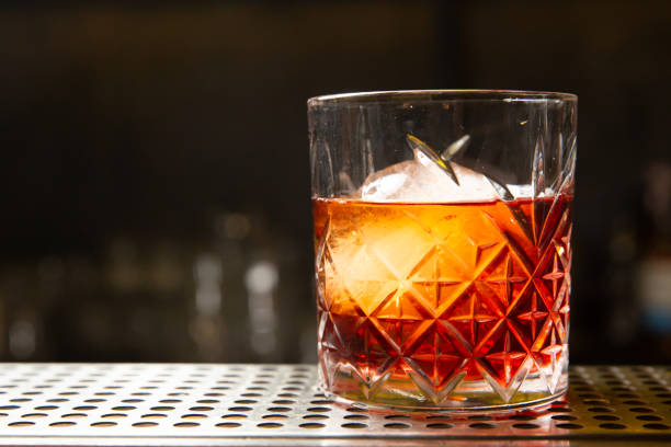istock Whiskey with an ice ball in a glass 1207458620