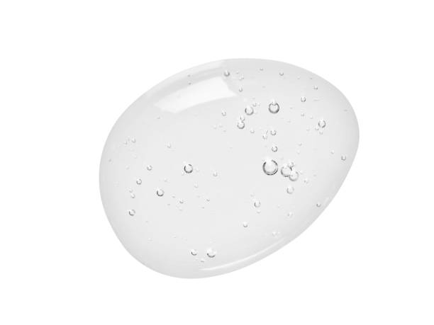 Liquid gel texture. Clear beauty serum drop isolated on white background Liquid gel texture. Clear beauty serum drop. Transparent skin care product swatch isolated on white background. Beauty product macrophotography shower gel stock pictures, royalty-free photos & images