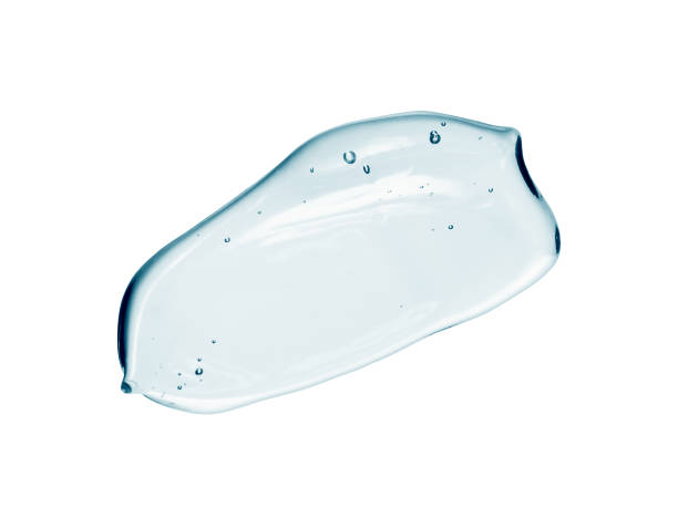 istock Face serum, light blue liquid gel smear isolated on white background 1207459706