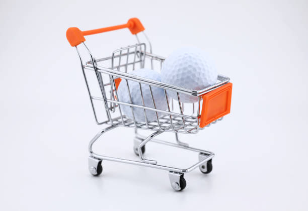 istock Golf balls and shopping trolley 1207462570
