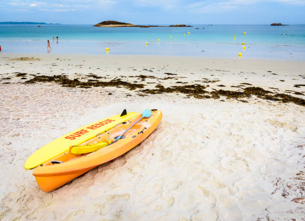 istock Lifeguards rescue surfboard and kayak lying on the beach. 1207465895
