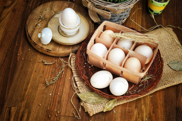 istock Close-up view of raw chicken eggs in egg box 1207467229