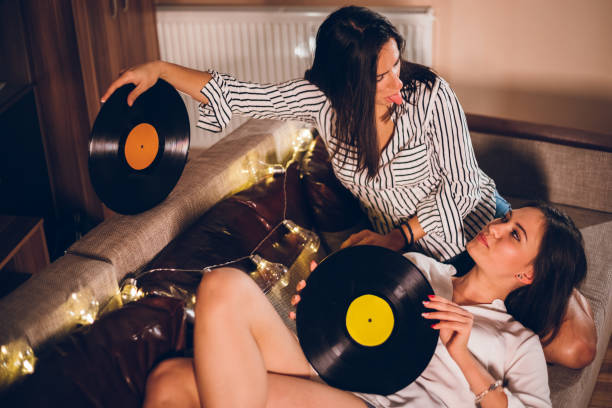 istock Two women listening to old records 1207468619