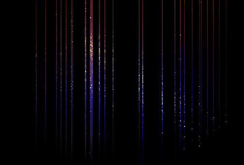 Purple-blue glittering threads on black background