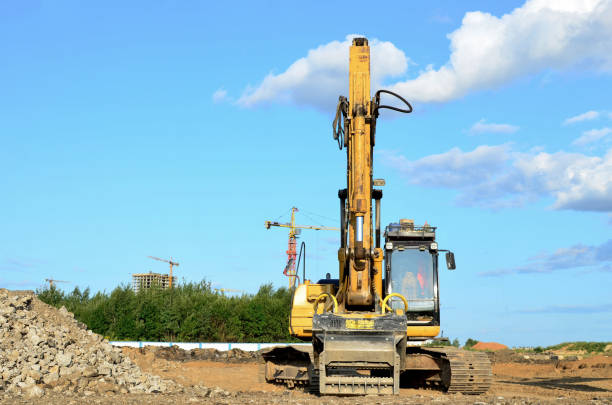 istock Excavator with crusher bucket for crushing concrete 1207471942