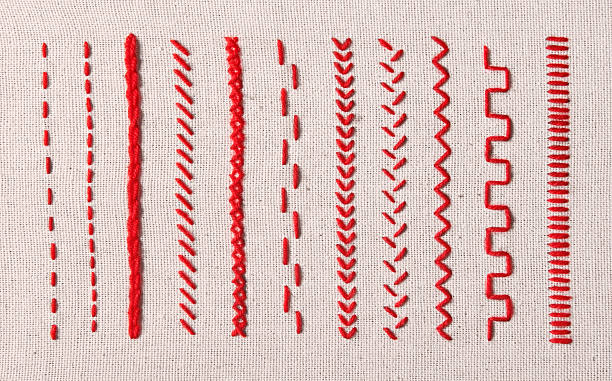 stickerei - red stitches stock-fotos und bilder