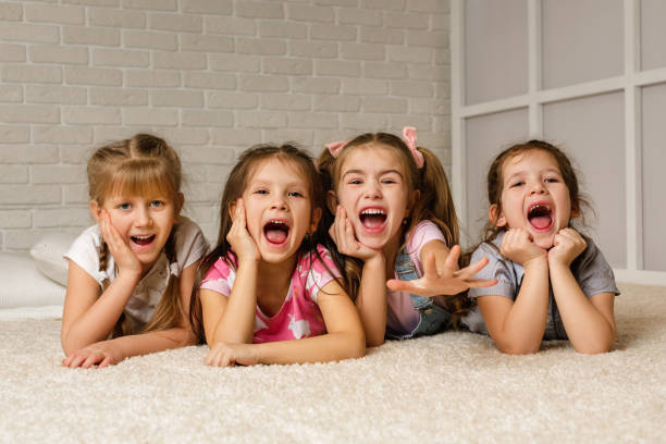 istock Group of kid lay down on floor together. 1207474876