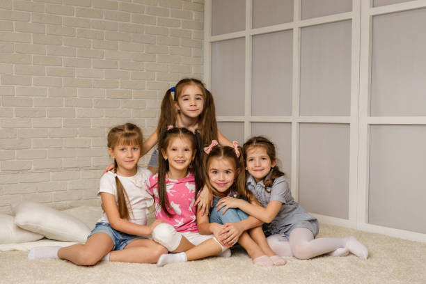 istock Group of kid lay down on floor together. 1207474878