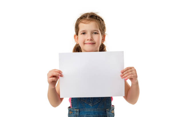 istock Happy cute child girl holding empty blank 1207475004
