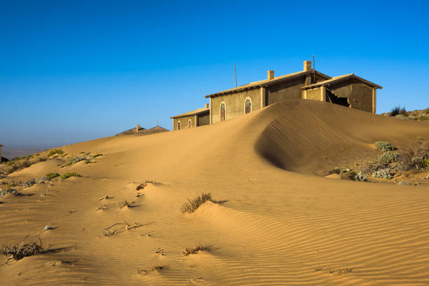 Abandoned houses in Kolmanskop ghost town located in the desert of southern Namibia near the town of Luderitz.