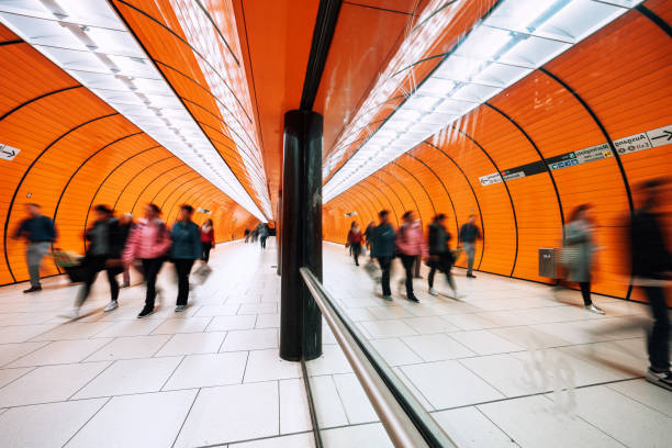istock motion blurred people passing pedestrian tunnel 1207476528