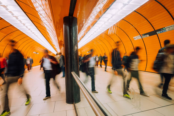 istock train station with motion blurred people passing pedestrian tunnel 1207476726