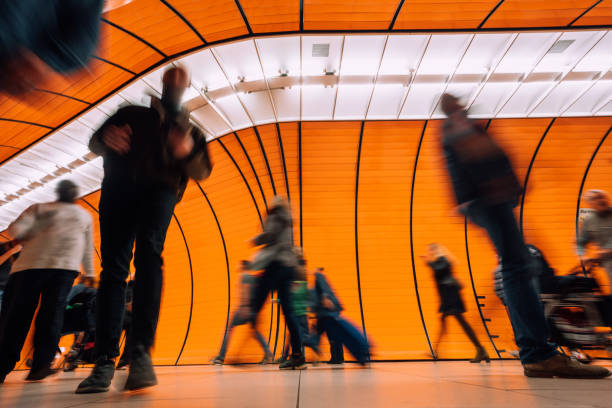 istock subway station with motion blurred people passing pedestrian tunnel 1207477689