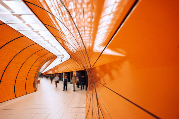istock motion blurred people passing pedestrian tunnel 1207477760