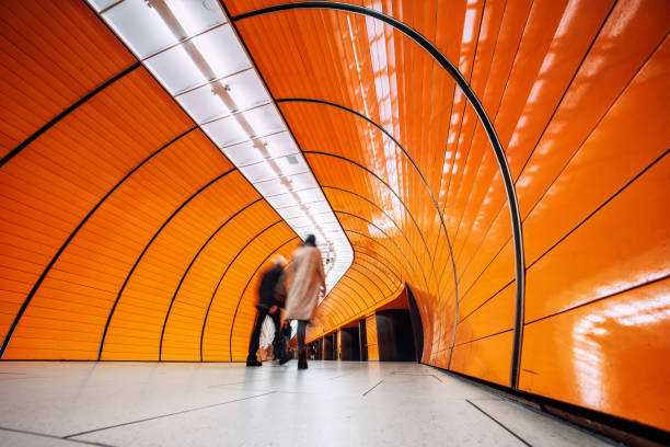 istock tunnel subway station with motion blurred people 1207477934