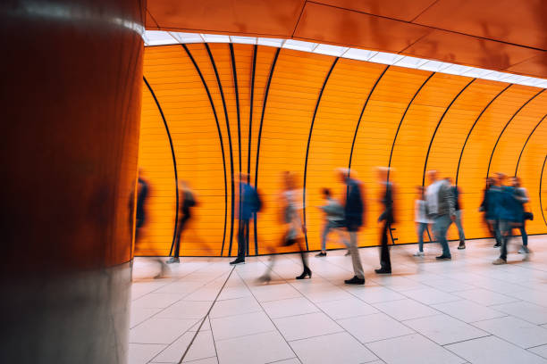 istock subway station with motion blurred people passing pedestrian tunnel 1207478032