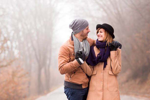 istock Couple enjoying outdoors in cold autumn / winter time. 1207479974