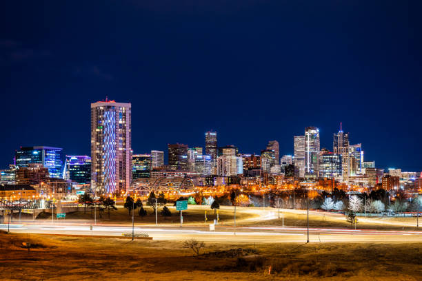 istock Denver skyline and busy traffic at night 1207480728