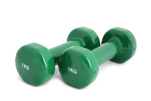 Two rubber coated dumbbell on white background