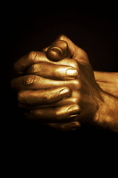 istock beautiful man's hands in gold paint 120748203