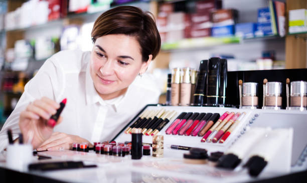 istock Customer browsing rows of cosmetic products 1207483228