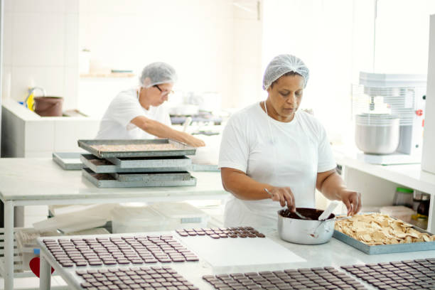 istock Woman preparing chocolate in a chocolate factory 1207484884