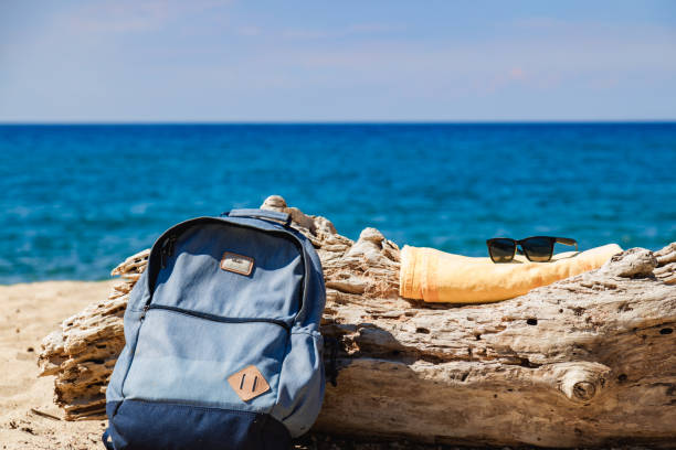 Tourist rucksack on a sandy tropical beach.