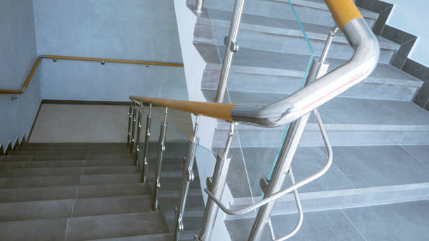 istock Stainless steel, glass and wood railing.Fall Protection. 1207485096