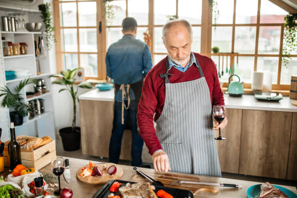 istock Father and Son Cooking Together at Home 1207486400