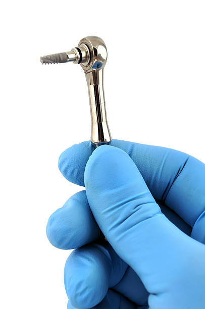 istock key for screwing the implant 120748710