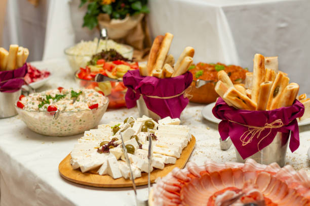 istock Catering buffet table with cold snacks. Delicious appetizers on the table, self serve. 1207487158