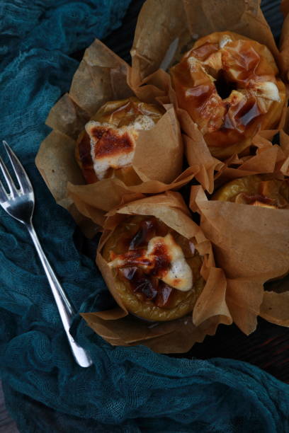 istock baked apples in parchment paper 1207488703