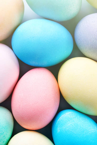 istock Colorful Easter eggs dyed by colored water with beautiful pattern on a pale blue background, design concept of holiday activity. 1207488737